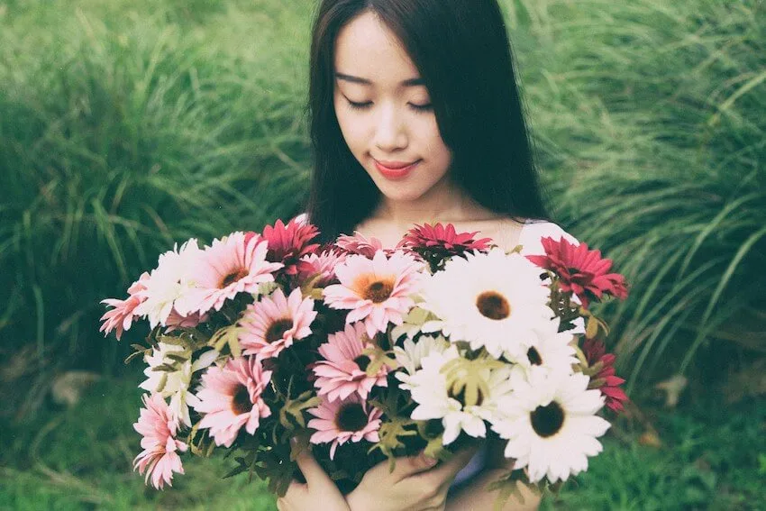 woman holding a bouquet of flowers