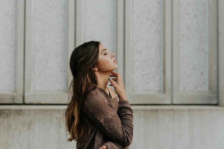 woman pondering with her eyes closed