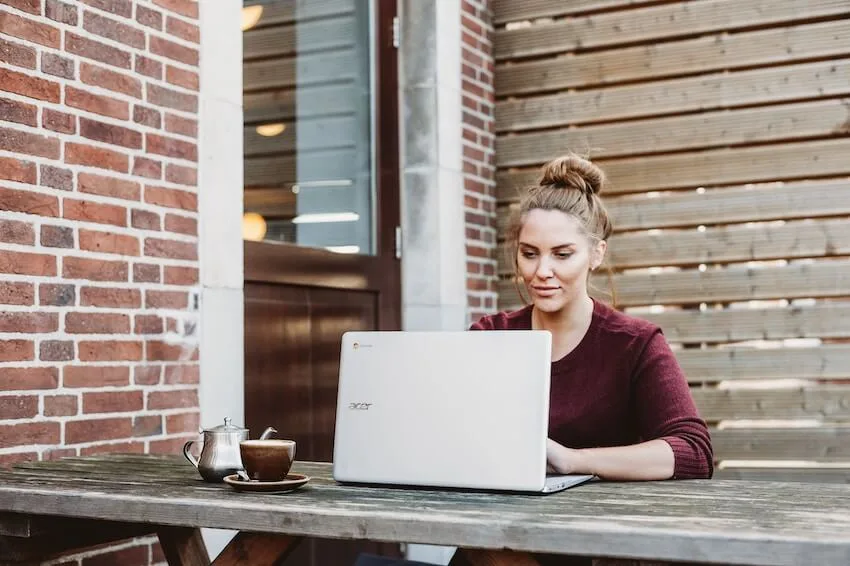 woman working outside on her laptop