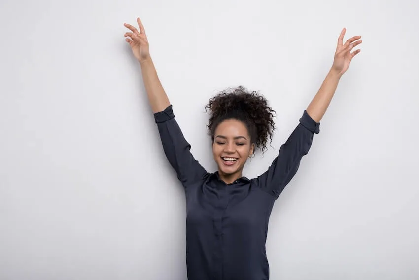 woman with her arms up in the air