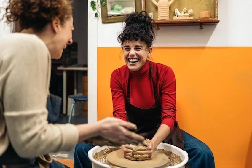 women making pottery