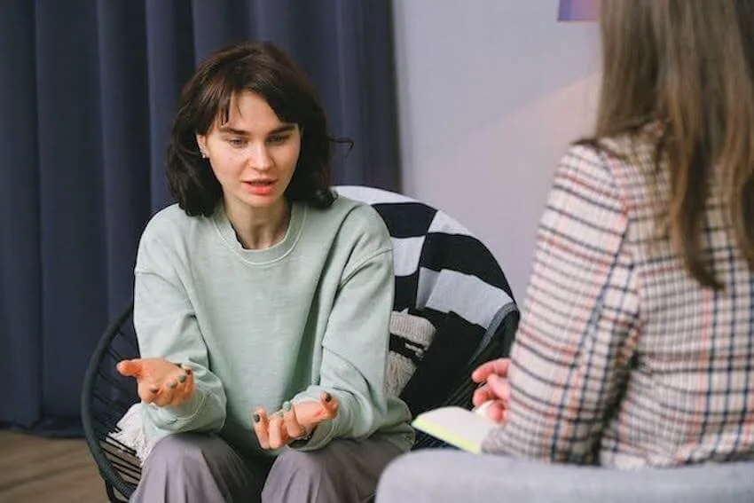 young woman talking to her therapist